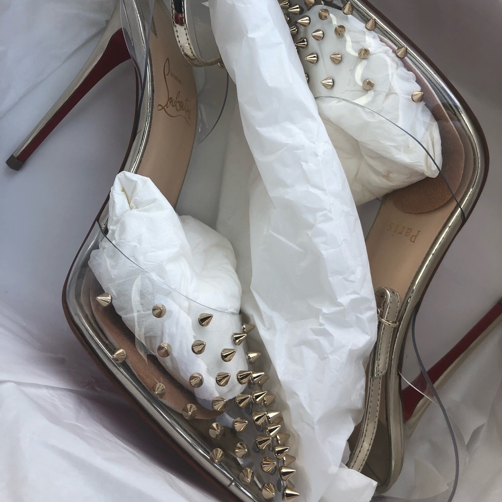 Christian Louboutin gold pumps